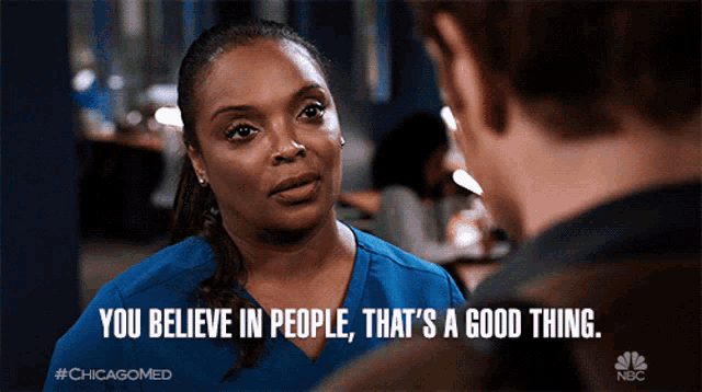 a woman talking to a man with the words you believe in people that 's a good thing below her