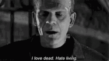 a black and white photo of frankenstein saying i love dead . hate living .