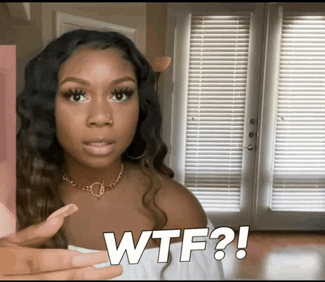 a woman with long nails says wtf