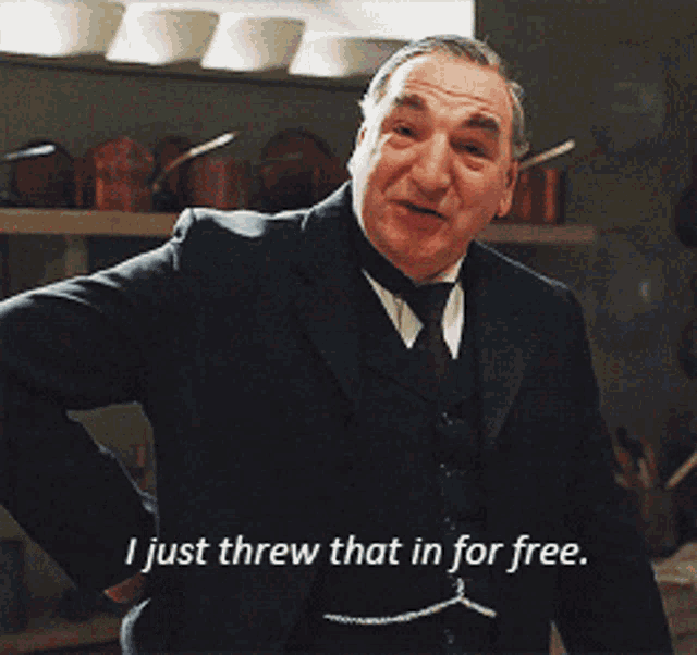 a man in a suit and tie is saying i just threw that in for free
