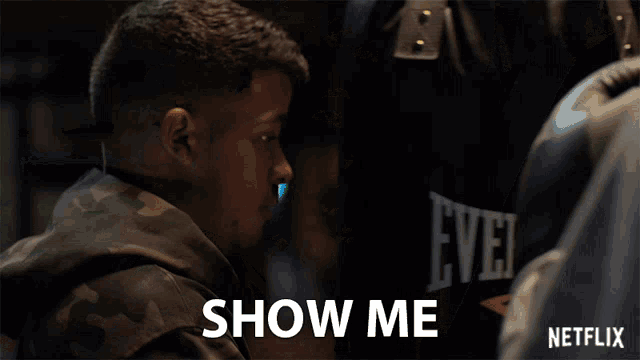 a man in a camo jacket says show me in a netflix ad