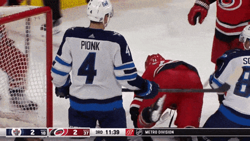 a hockey player with the number 4 on his back