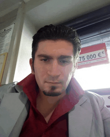 a man sitting in front of a sign that says 75,000 euro