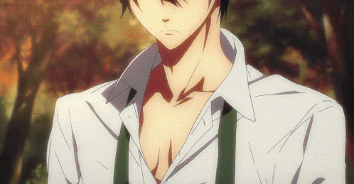 a close up of a man 's chest in a white shirt with suspenders