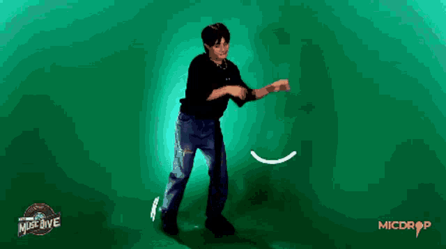 a man is dancing in front of a green background that says must dive on it