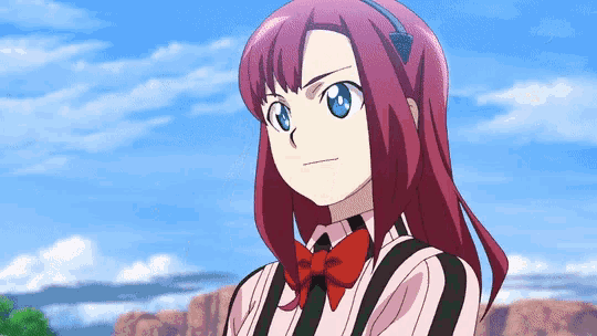 a girl with red hair and blue eyes is wearing a striped shirt