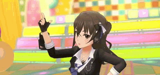 a girl in a suit and tie is standing in front of a colorful background and giving a thumbs up .