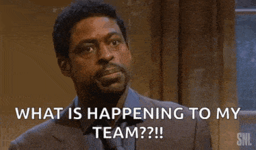 a man in a suit is asking what is happening to his team .