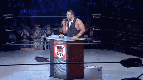 a man stands at a podium that says " fact of life " on it