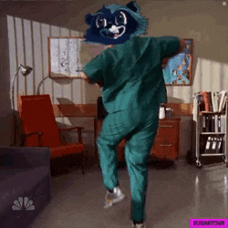 a surgeon with a raccoon head is dancing in a hospital room .
