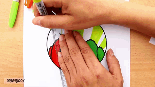 a person is using a ruler to draw a heart on a piece of paper ..