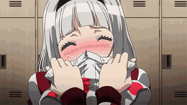 a girl with white hair is covering her face with a sweater