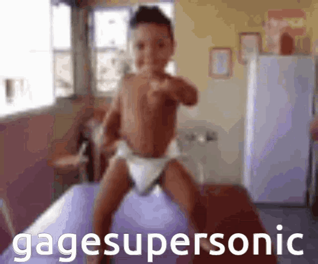 a baby in a diaper is standing on a purple ball with the words gagesupersonic in the corner