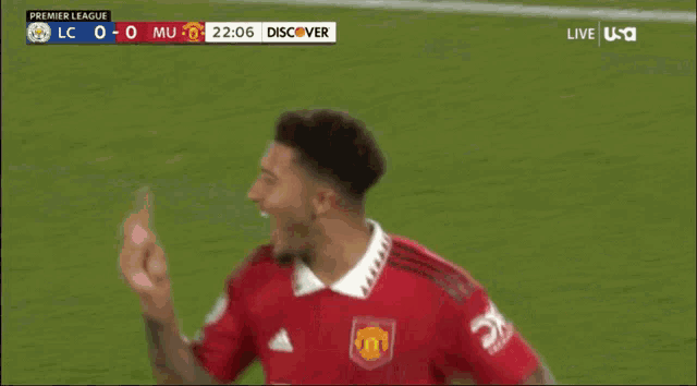 a man in a red shirt with the number 25 on the back