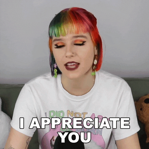a woman says i appreciate you while wearing a flamingo t-shirt