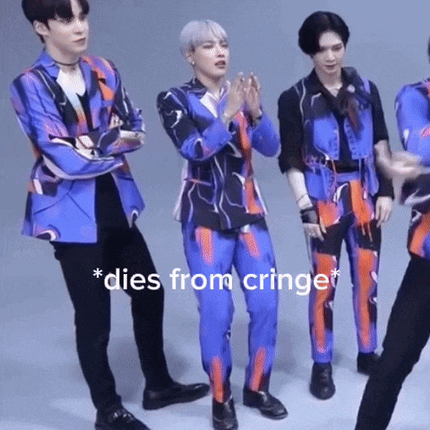 a group of men are standing next to each other and one of them is wearing a blue suit that says dies from cringe