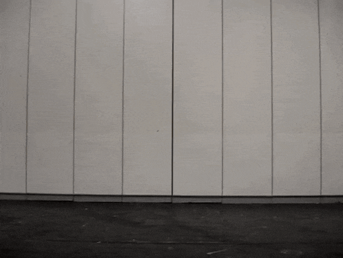 a person in a black and gold power ranger costume is dancing