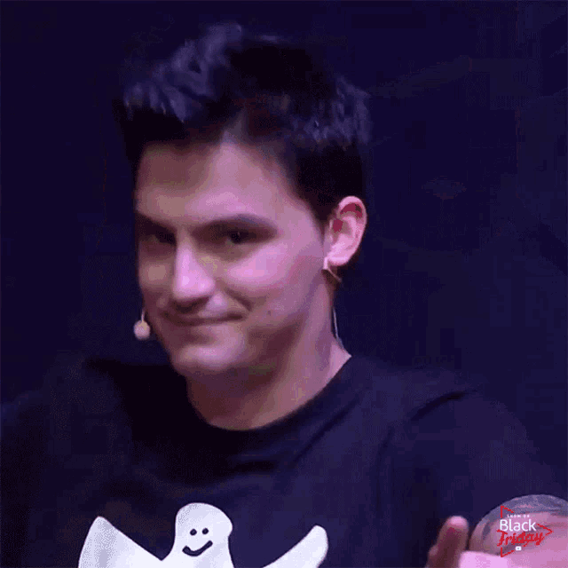a man in a black shirt with a ghost on it