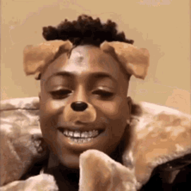 a man wearing a fur coat and a dog mask on his face .