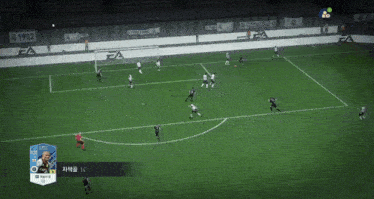 a soccer game is being played on a field with a 1902 banner on the side