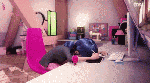 a cartoon character is sleeping on a desk in front of a computer in a room .