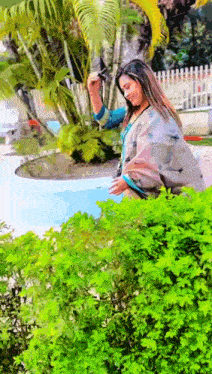 a woman taking a picture of herself with her phone