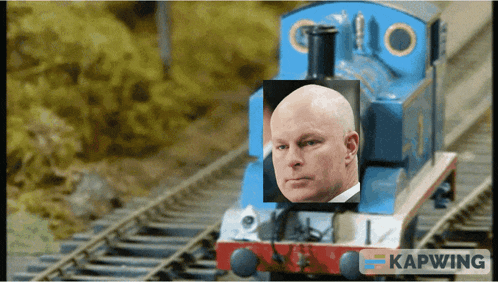 a blue train with a picture of a man on the front of it