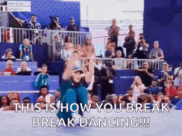 a man is dancing in front of a crowd with the words this is how you break break dancing !!!