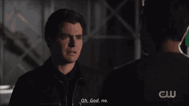 a man talking to another man with the words oh god no visible