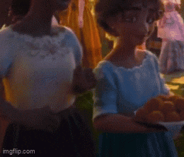 a girl in a blue dress is holding a bowl of eggs and smiling .