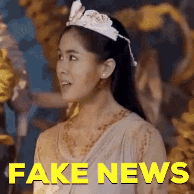 a woman with a crown on her head is standing in front of a fake news sign