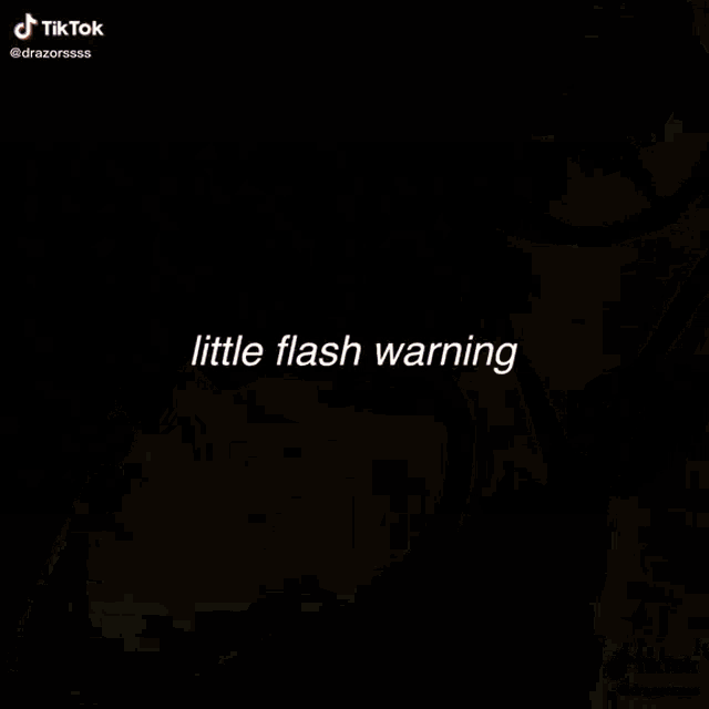 a video of a person holding a sword with the words `` little flash warning '' written on the bottom .