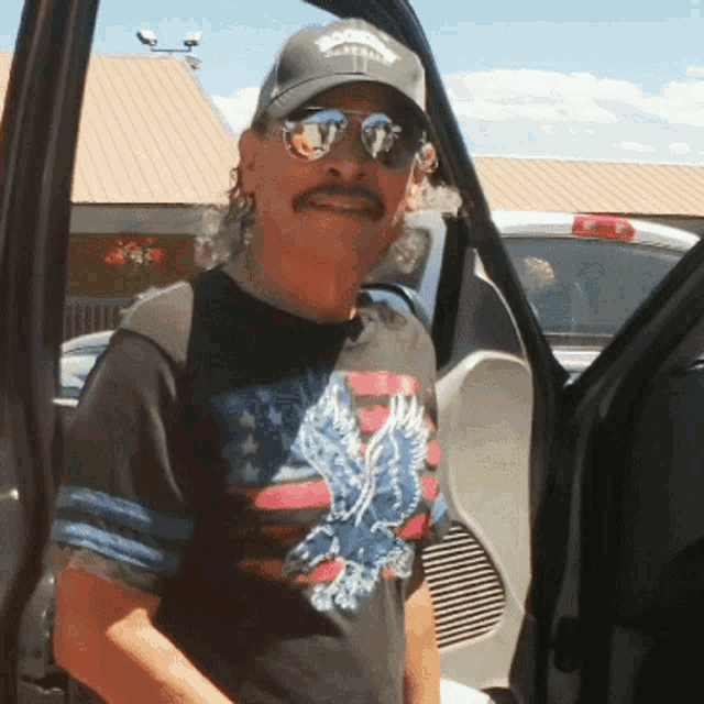 a man wearing sunglasses and a hat that says boomerang