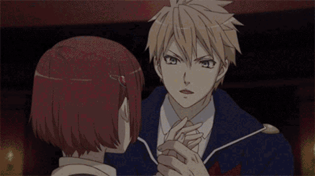 a man with red hair and blue eyes is looking at another man