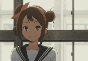 a girl in a sailor suit with a red headband on her head