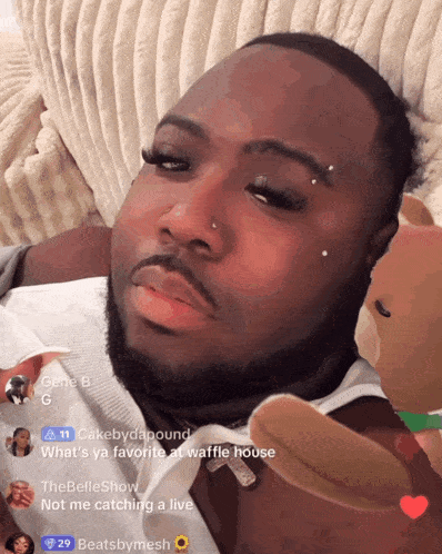 a man laying on a couch with a teddy bear and a hashtag that says " cakebydapound "
