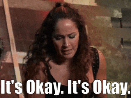 a woman says " it 's okay it 's okay " while looking down