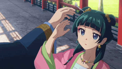 a girl with green hair is getting her hair done by someone