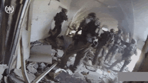 a group of soldiers are walking through a building