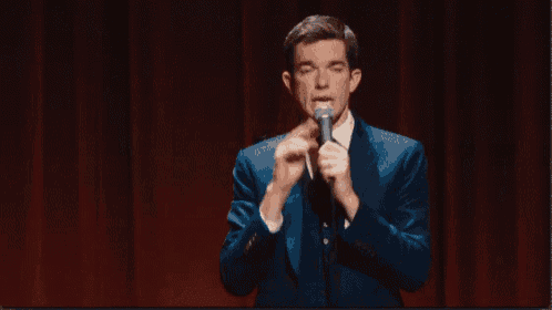 a man singing into a microphone with the words " eat ass suck a dick and sell drugs " written below him