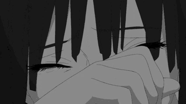 a black and white image of a girl crying