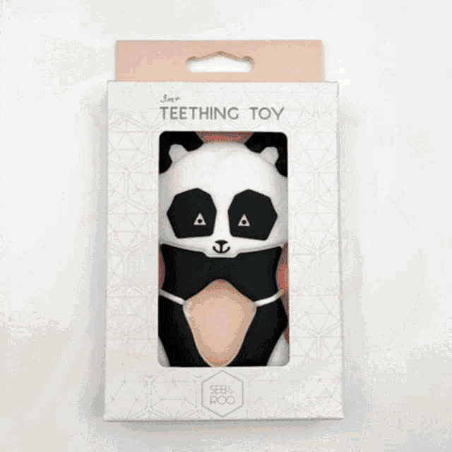 a teething toy in a box with a panda on it