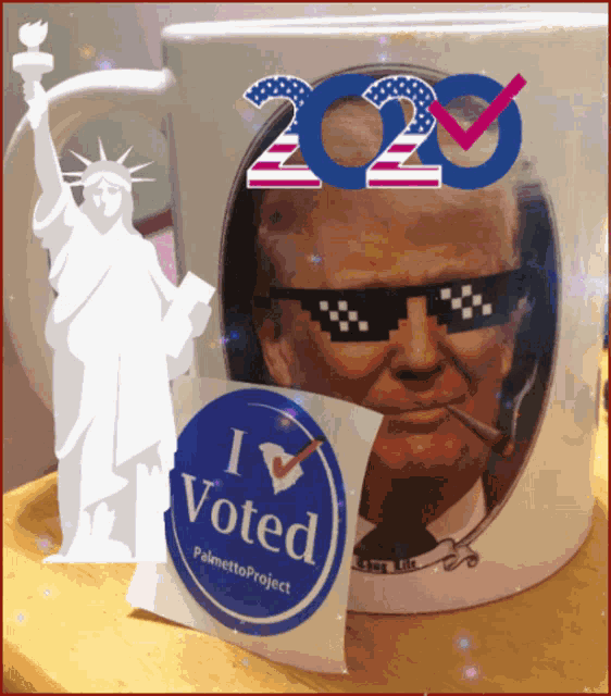 a mug with a picture of donald trump and a sticker that says " i voted "