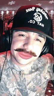 a man with a mustache wearing a hat that says ' os tan ' on it