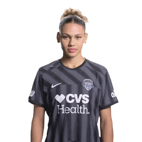 a woman giving a thumbs up wearing a cvs health shirt