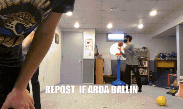 a man playing basketball in a basement with the caption repost if arda ballin on the bottom