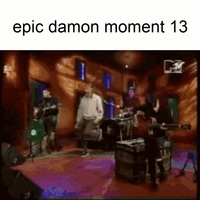 a group of people playing instruments in a room with the words epic damon moment 13 on the top