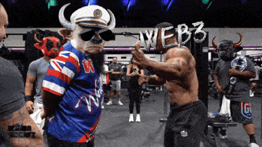 a group of people in a gym with web3 written on the wall behind them