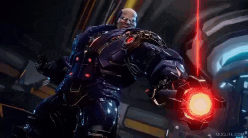 a man in a futuristic suit is holding a red object in his hand and says hi world .