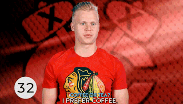 a man in a red shirt that says coffee or tea
